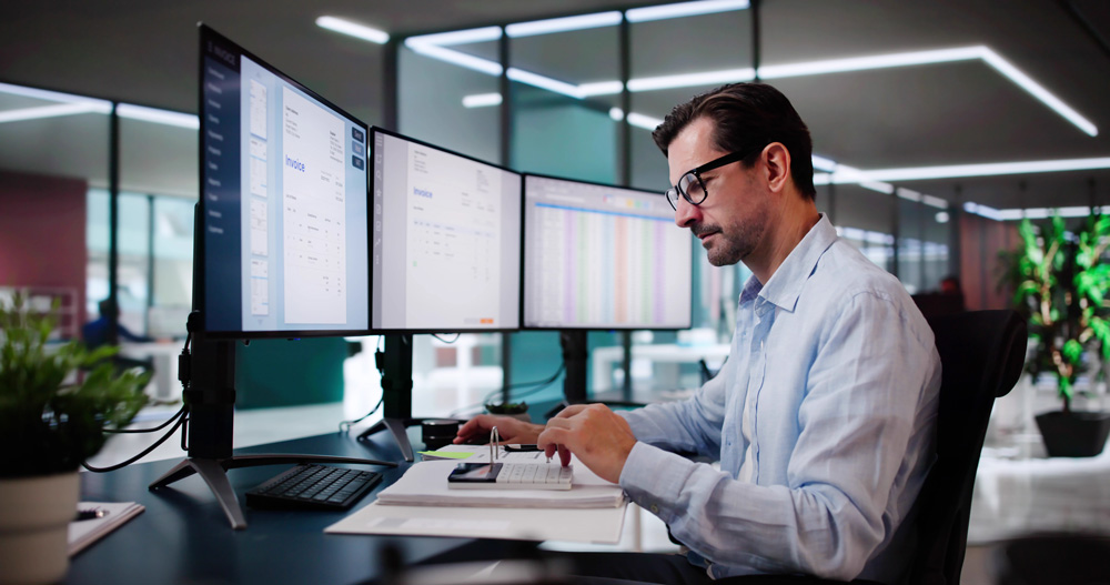 man working as a medical biller