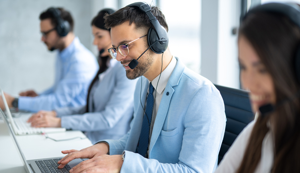 Customer service IT representatives with headsets talking to customers