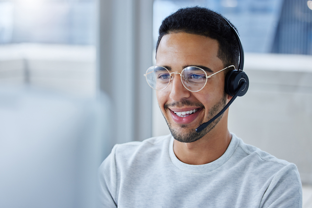 customer service representative with headset at desktop
