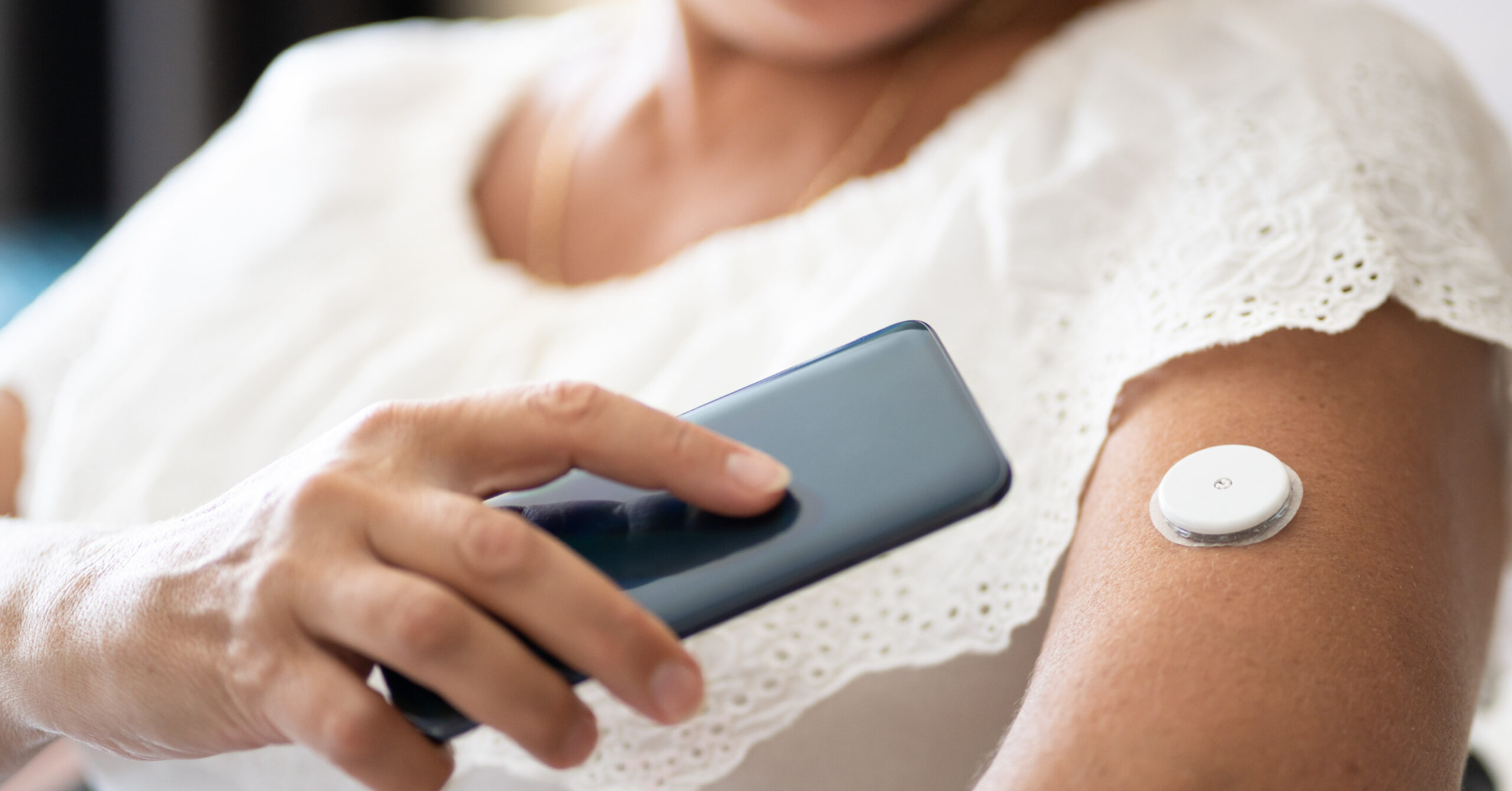 continuous glucose monitor on arm